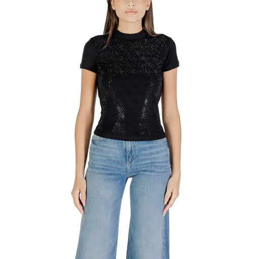 Guess Women Black Short Turtleneck T Shirt paired with light blue wide-leg jeans