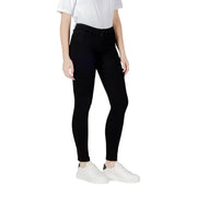 Black skinny jeans displayed in a product image showcasing fitted denim style