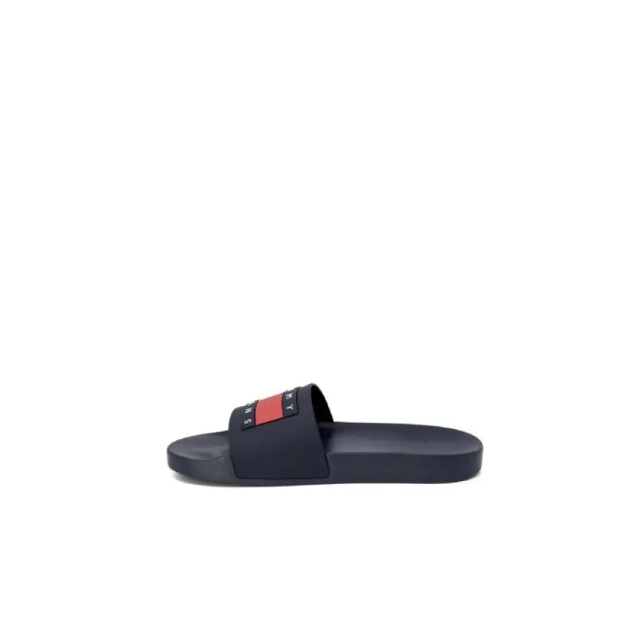 
                      
                        Tommy Hilfiger Jeans men’s black slide sandals with red and white logo
                      
                    