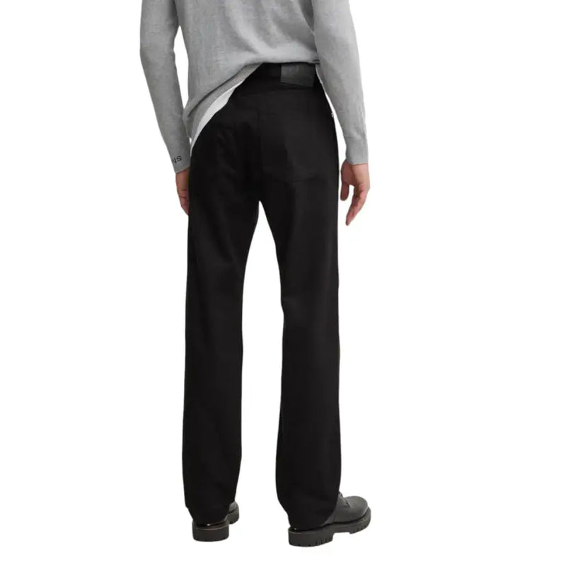 Mens black straight leg trousers displayed on a model, suitable for formal or casual wear