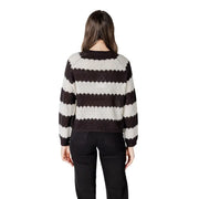 A cozy black striped long sleeve round neck acrylic sweater with bold black and cream horizontal knit stripes