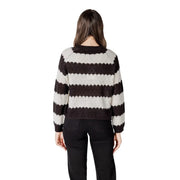 A cozy black striped long sleeve round neck acrylic sweater with bold black and cream horizontal knit stripes