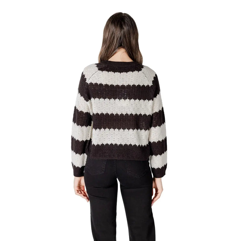 A cozy black striped long sleeve round neck acrylic sweater with bold black and cream horizontal knit stripes