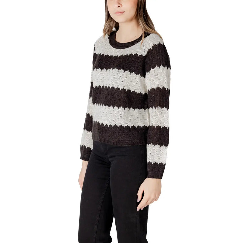 Black striped long sleeve round neck acrylic sweater with a cozy black and white striped knit and ribbed crew neck