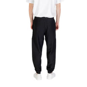 Black Calvin Klein sweatpants with elastic cuffs displayed in a product image