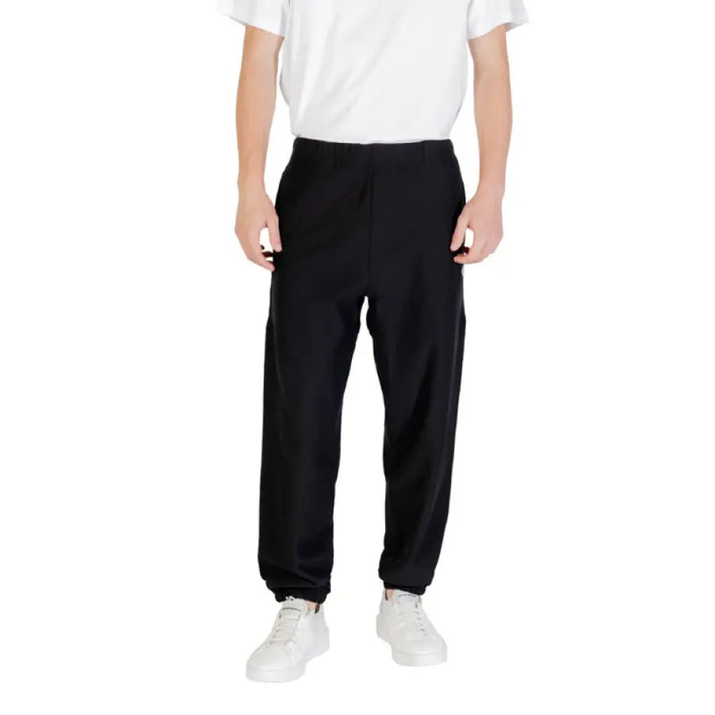 Black Calvin Klein sweatpants with elastic cuffs and comfortable fit for casual wear