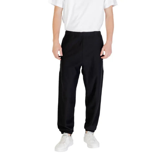 Black Calvin Klein sweatpants with elastic cuffs and comfortable fit for casual wear