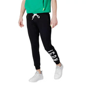 Black sweatpants with white drawstring featuring icon lettering on the leg in comfortable jogger style