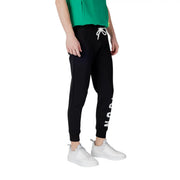 Black sweatpants with white drawstring featuring vertical lettering on the side made of comfortable jogger material