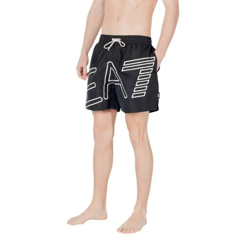 Black swim trunks with a white logo for men’s swimming apparel