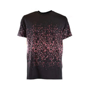 Black T shirt featuring a pink splatter pattern design for stylish casual wear