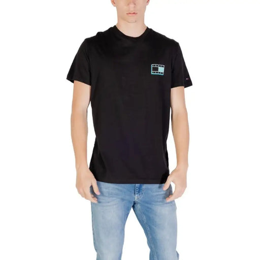 Black Tommy Hilfiger T shirt with square logo displayed on a product page
