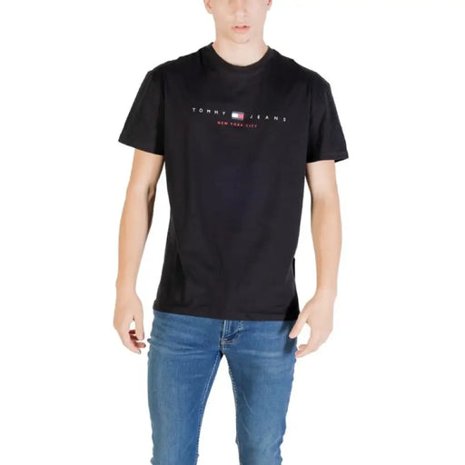 Black Tommy Jeans T-Shirt displayed on a model for the Tommy Jeans Navy Blue T Shirt product