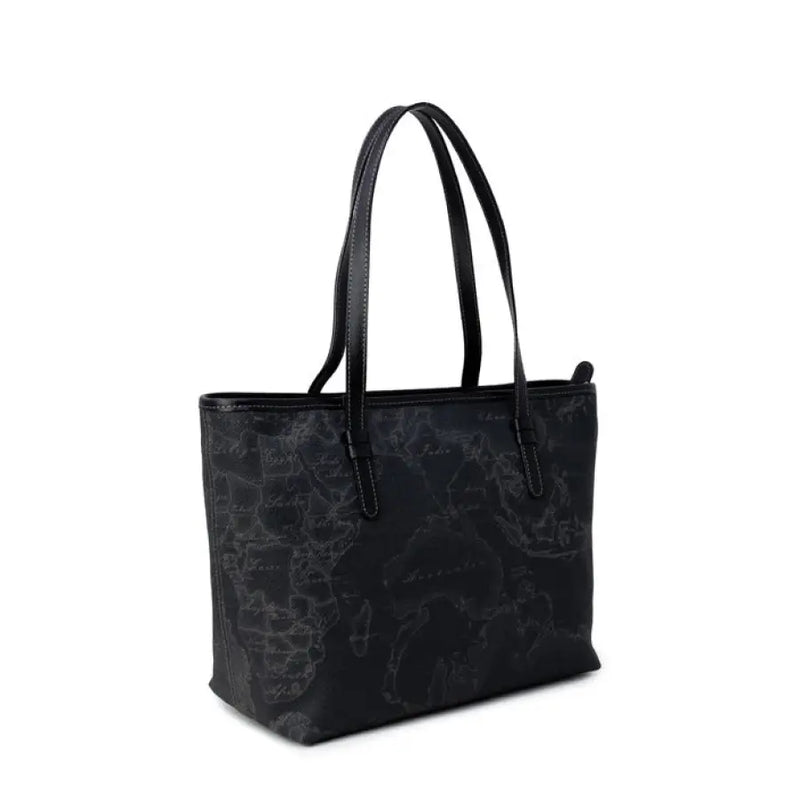 Black tote bag featuring a detailed world map pattern ideal for travel lovers