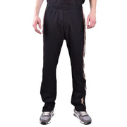 Black track pants with stylish side stripes displayed in the product listing