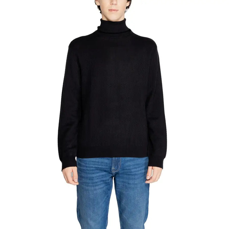 Black ribbed turtleneck sweater by Armani Exchange featuring a fitted silhouette and long sleeves