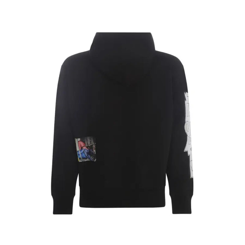 Black hooded sweatshirt with graphic patches, stylish and modern men’s casual wear