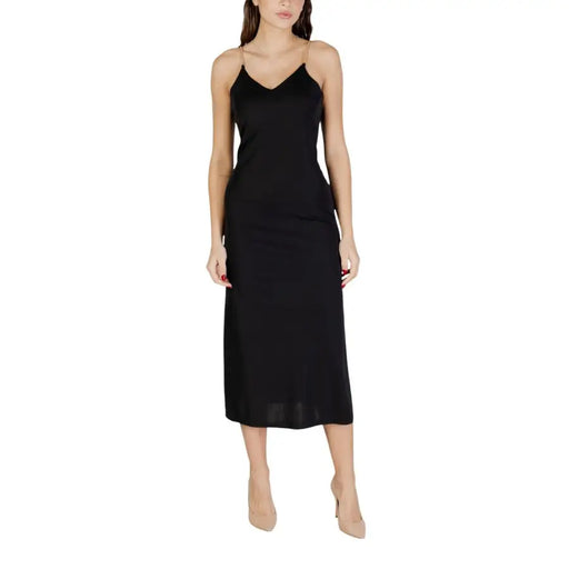 Black v-neck strappy satin slip dress by Morgan De Toi with thin spaghetti straps and elegant silhouette