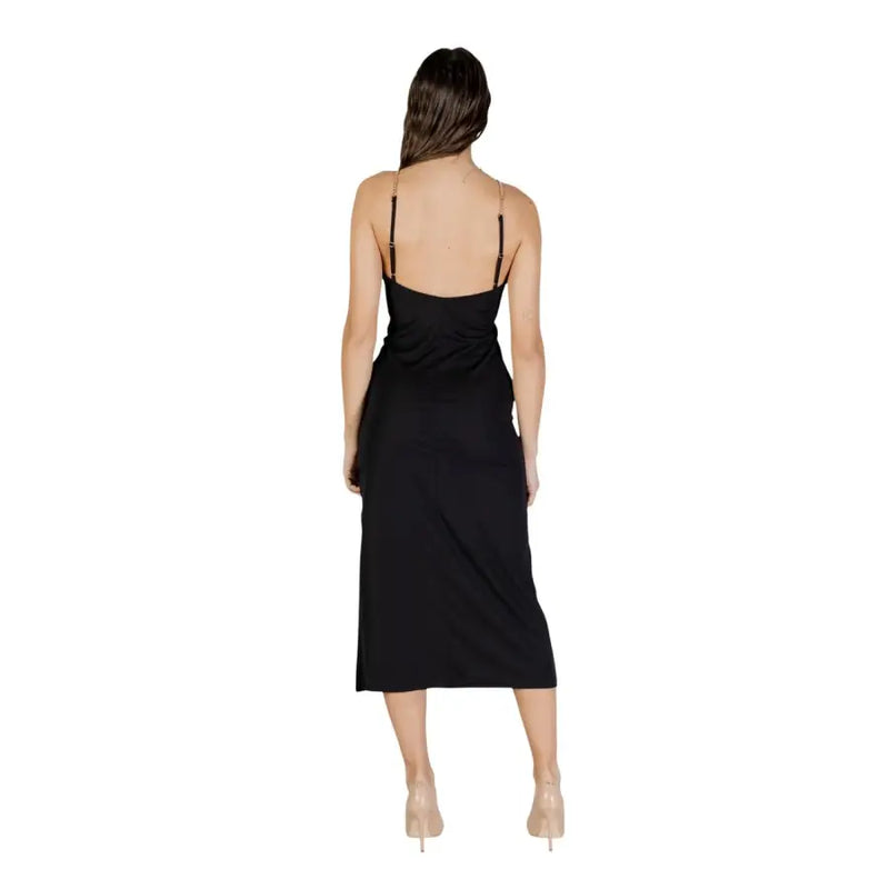 Black satin midi dress by Morgan De Toi featuring thin spaghetti straps and a draped back detail shown from the back