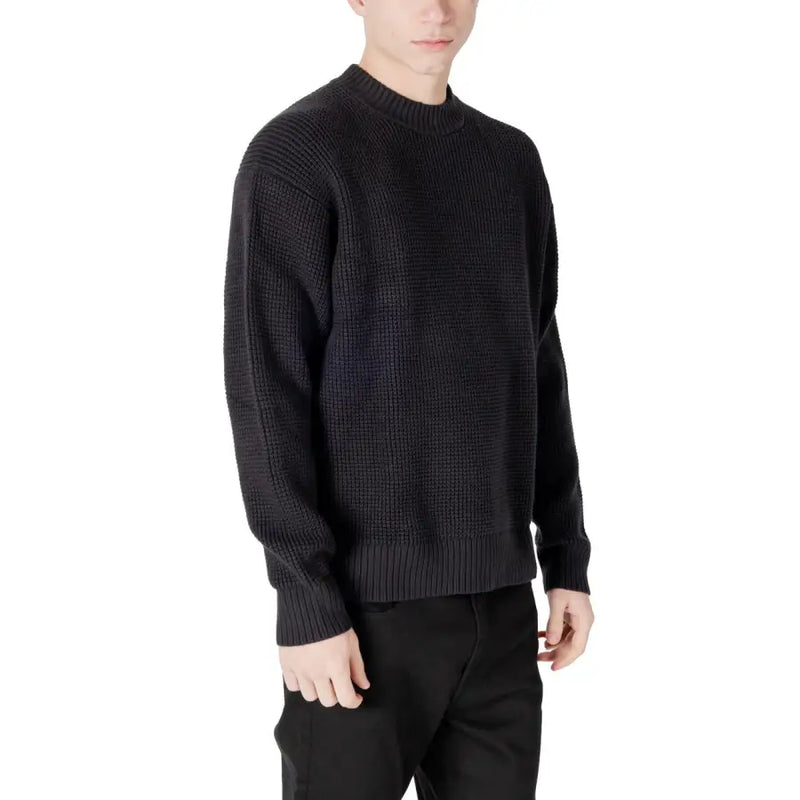 Black waffle-knit sweater displayed in the Black Waffle Knit Sweater product image