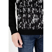 Black and white patterned turtleneck sweater with abstract design for women