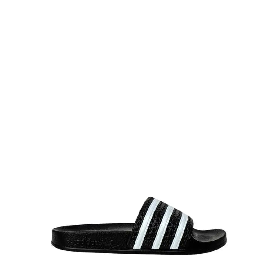 Adidas Men Slippers in urban city style featuring a black and white slider with a white stripe