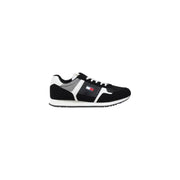 Black and white Tommy Hilfiger sneaker displayed in a product image