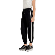 Black women’s track pants with white side stripes from Liu Jo featuring lace details