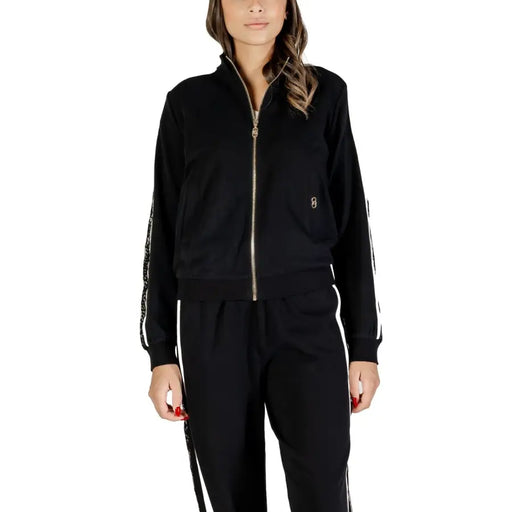 Black women’s tracksuit with white side stripes and gold zipper from Liu Jo