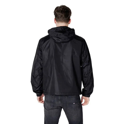 Men’s black hooded windbreaker jacket with dark grey jeans from Armani Exchange