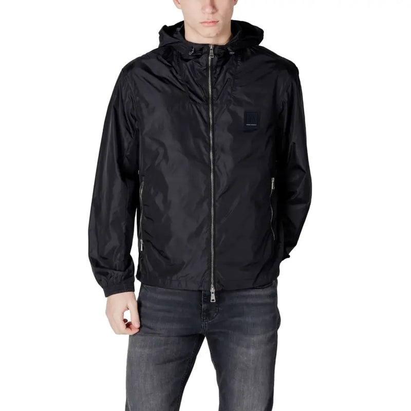 Men’s black hooded windbreaker jacket with full zipper and dark wash jeans by Armani Exchange