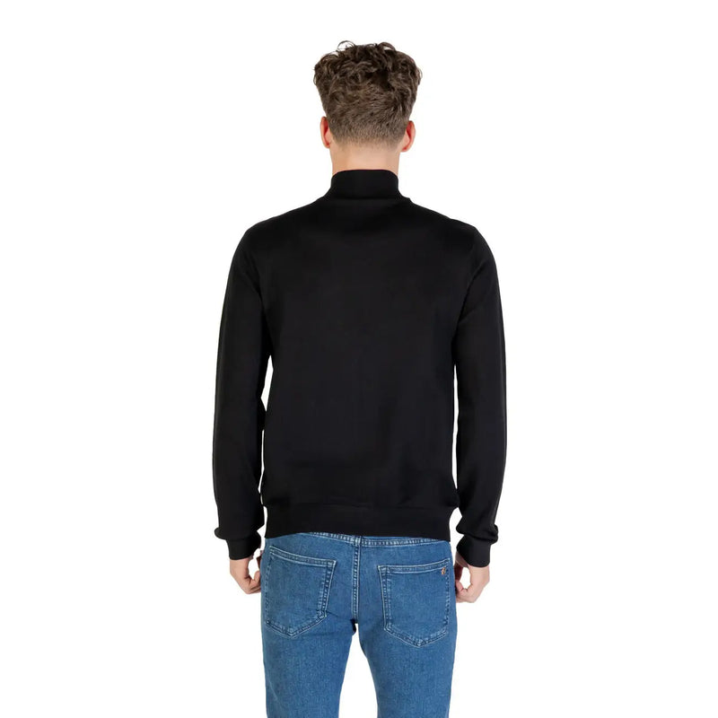 Black zip turtleneck knitwear by Armani Exchange featuring a smooth fitted silhouette and ribbed cuffs