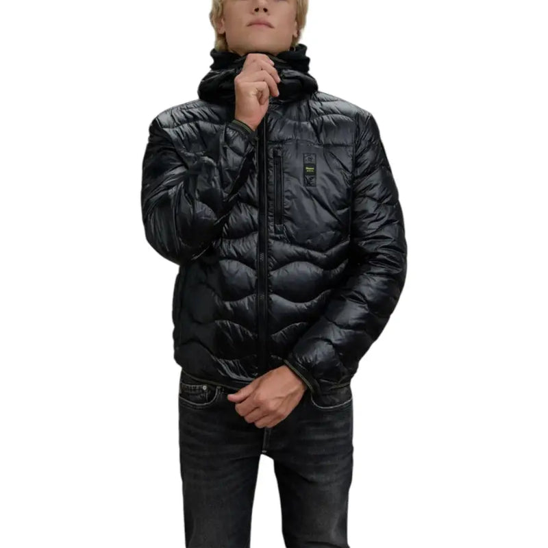 Black quilted puffer jacket with hood and zipper closure.