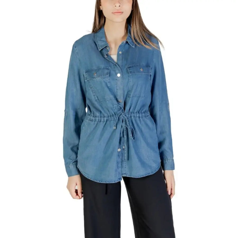 Blue denim drawstring shirt displayed in a product image