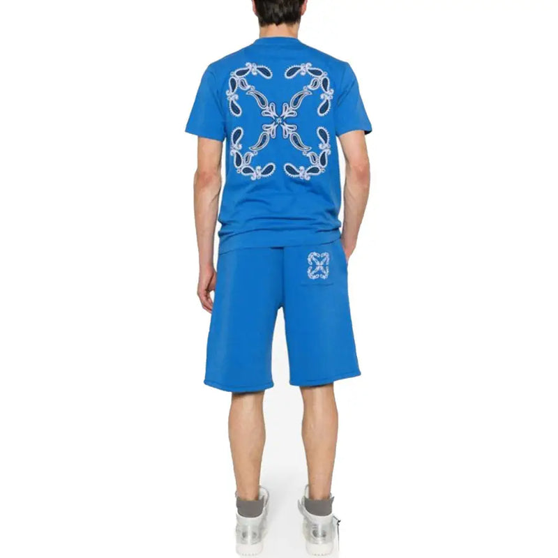 Blue short-sleeved t-shirt from Off-white showing the back with a white embroidered paisley pattern on bright fabric