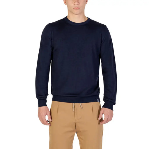 Navy blue crew neck sweatshirt with ribbed cuffs and hem, likely made of cotton or polyester blend.