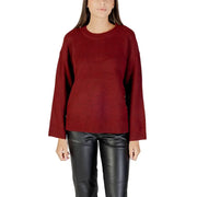 Women wearing Bordeaux round neck long knitwear with black leather pants for fall winter style