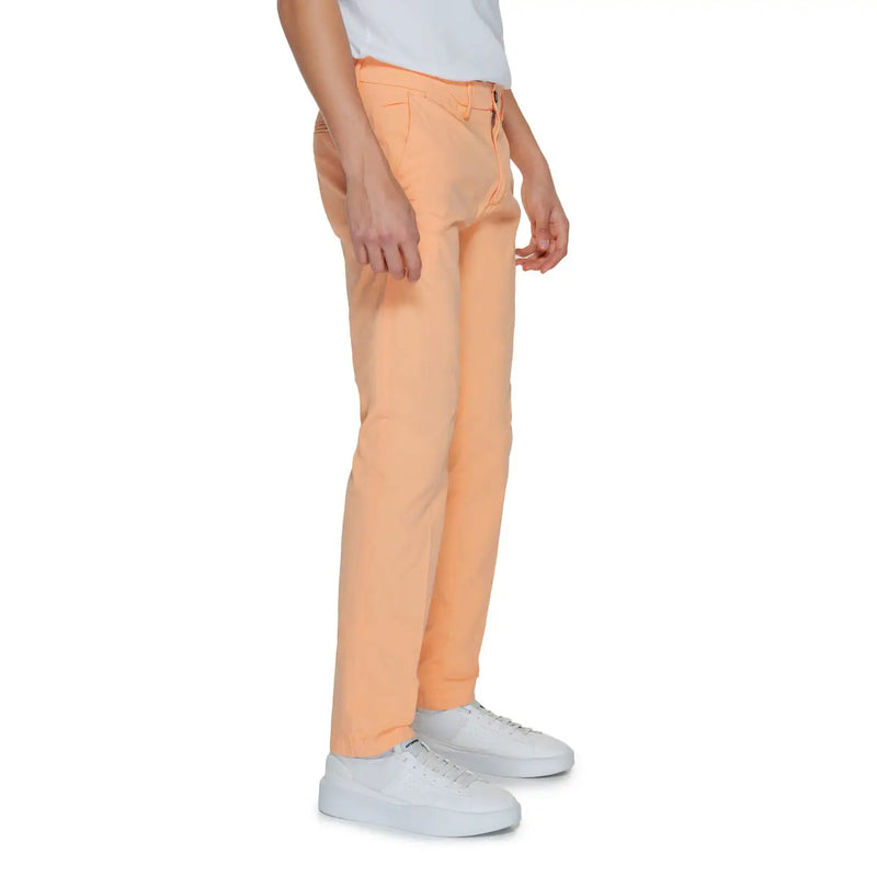 A pair of peach-colored slim-fit Borghese men trousers made from smooth cotton blend fabric