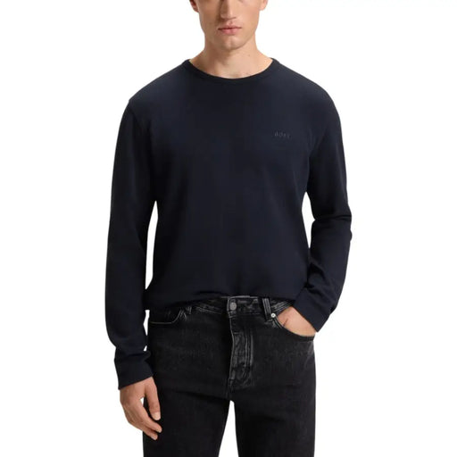 Navy blue crew neck long-sleeve t-shirt with a subtle logo on the chest.