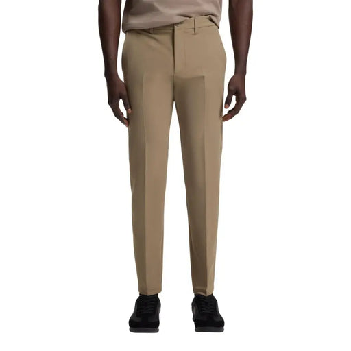 Khaki slim-fit Boss men trousers made of smooth tailored fabric ideal for formal and business wear