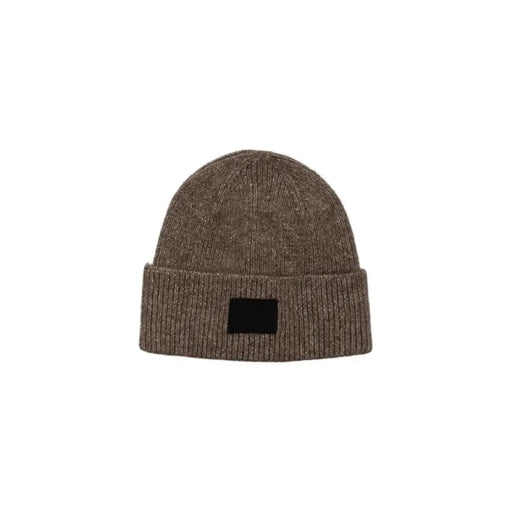 Brown knit beanie featuring a black patch, designed as the Beige Knit Beanie With Black Patch