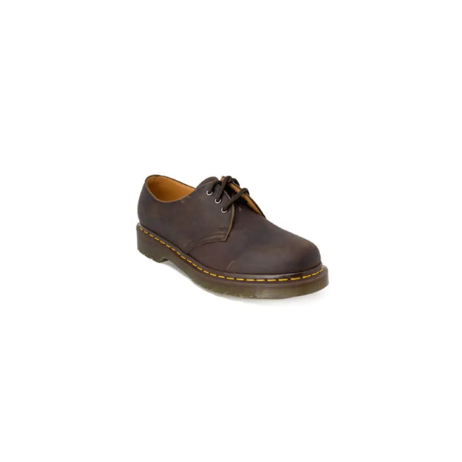 Brown Dr. Martens slip-on shoe with lace, showcasing urban city style clothing