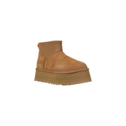 Brown suede platform UGG boot displayed in a high-quality product image