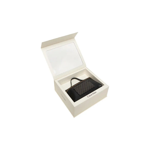Black quilted Calvin Klein mini handbag in white gift box