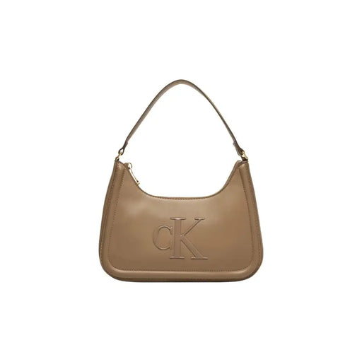 Beige polyurethane handbag by Calvin Klein with zip closure and prominent ck logo embossed on the front
