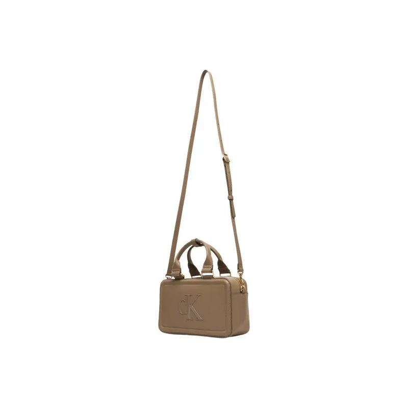 Calvin Klein beige leather crossbody bag with structured rectangular shape and gold-tone ck logo on front with zipper closure
