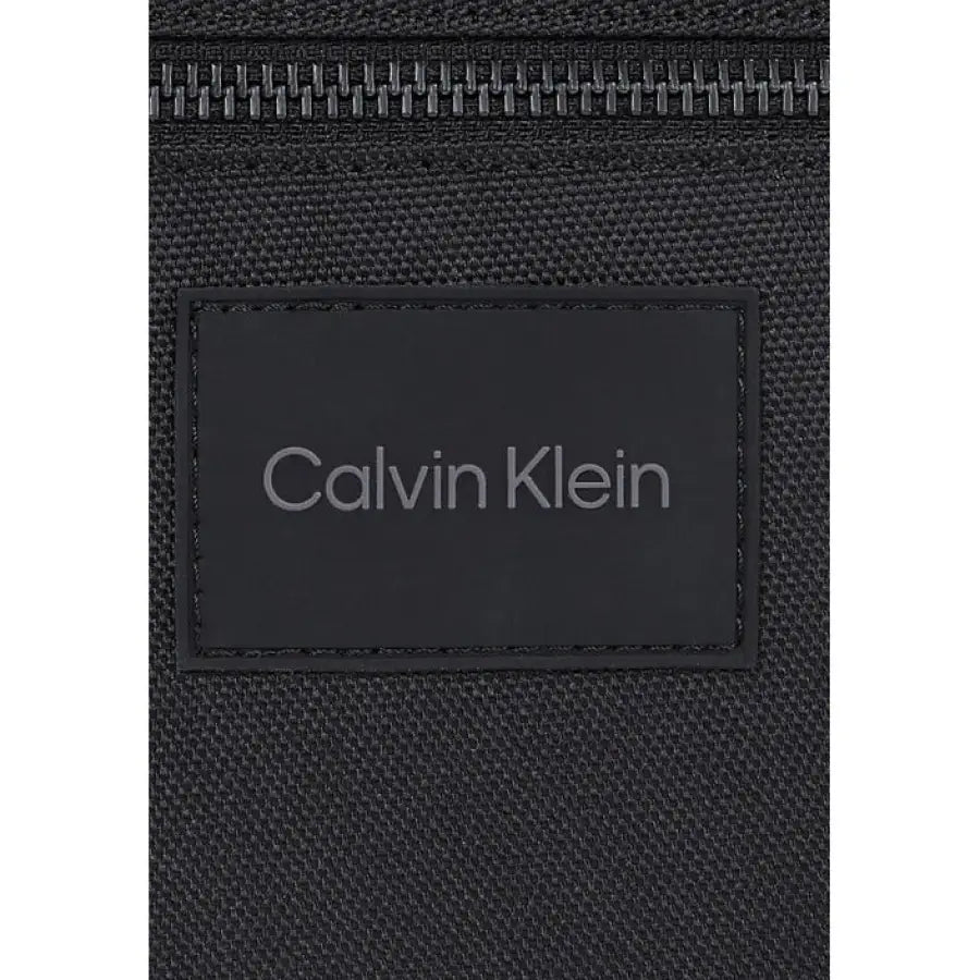 
                      
                        Calvin Klein black nylon and leather wallet, perfect for urban style clothing
                      
                    
