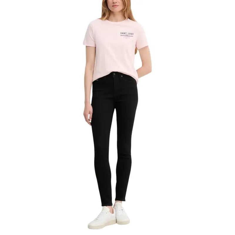 Calvin Klein black high-waisted skinny cotton jeans for women shown from the back side
