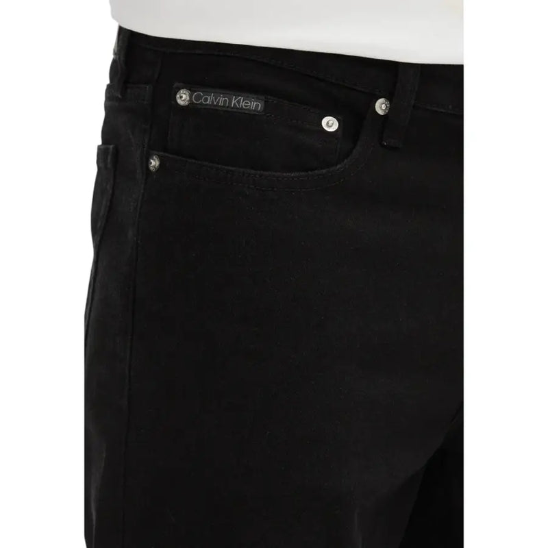 Calvin Klein black cotton stretch men shorts with sleek dark denim finish and silver toned button details