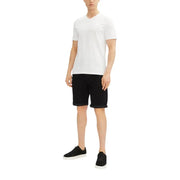 White v-neck cotton t-shirt with short sleeves paired with versatile calvin klein black cotton stretch men shorts